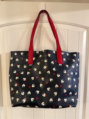 kate spade navy tote with red handles and cherry print